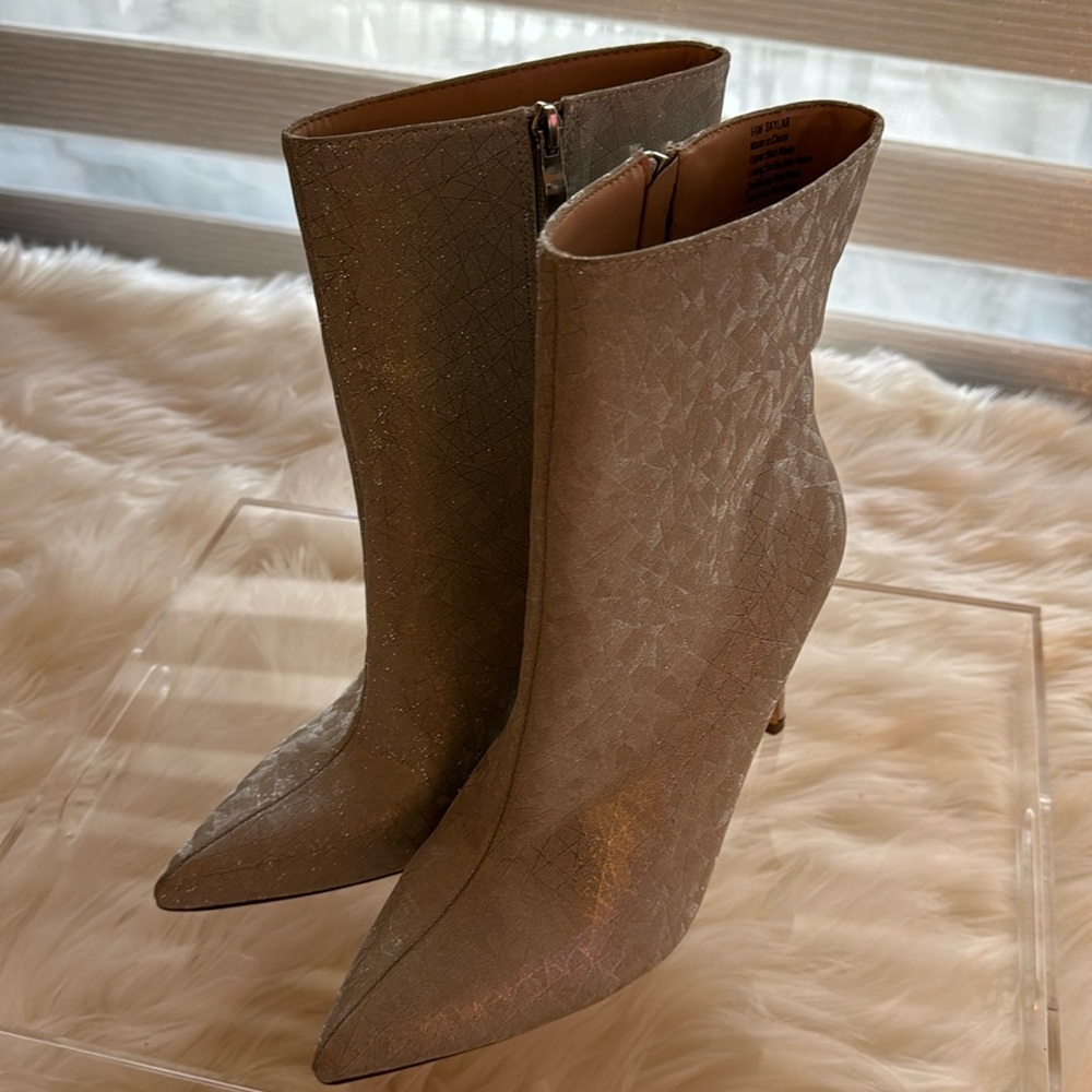 Elditas silver shimmering booties. Women's size 9.5  4 inch heel